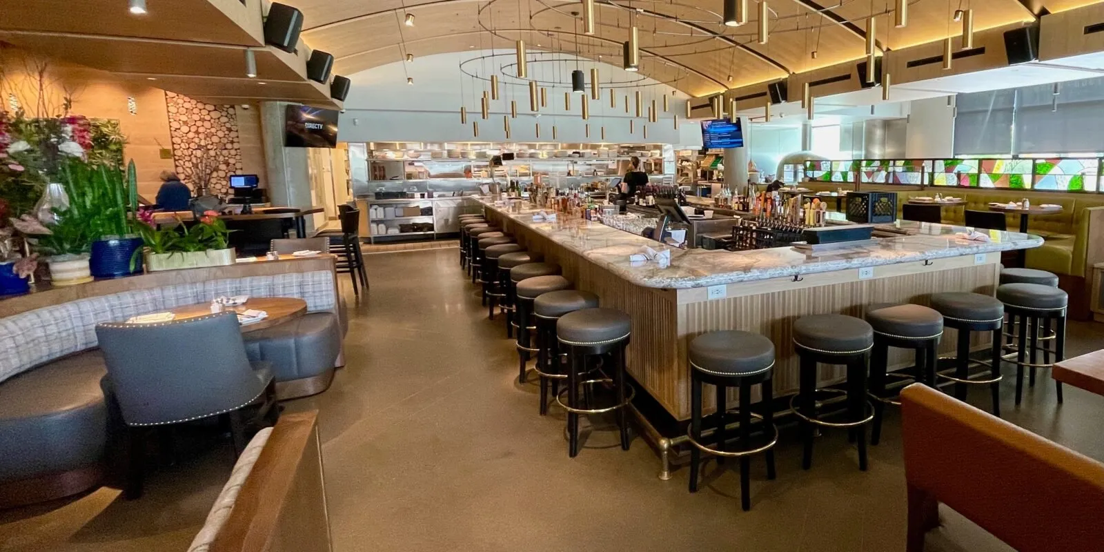 The Hazelwood bar in Bloomington: a long counter under a high arched ceiling, light pouring in from floor-to-ceiling windows