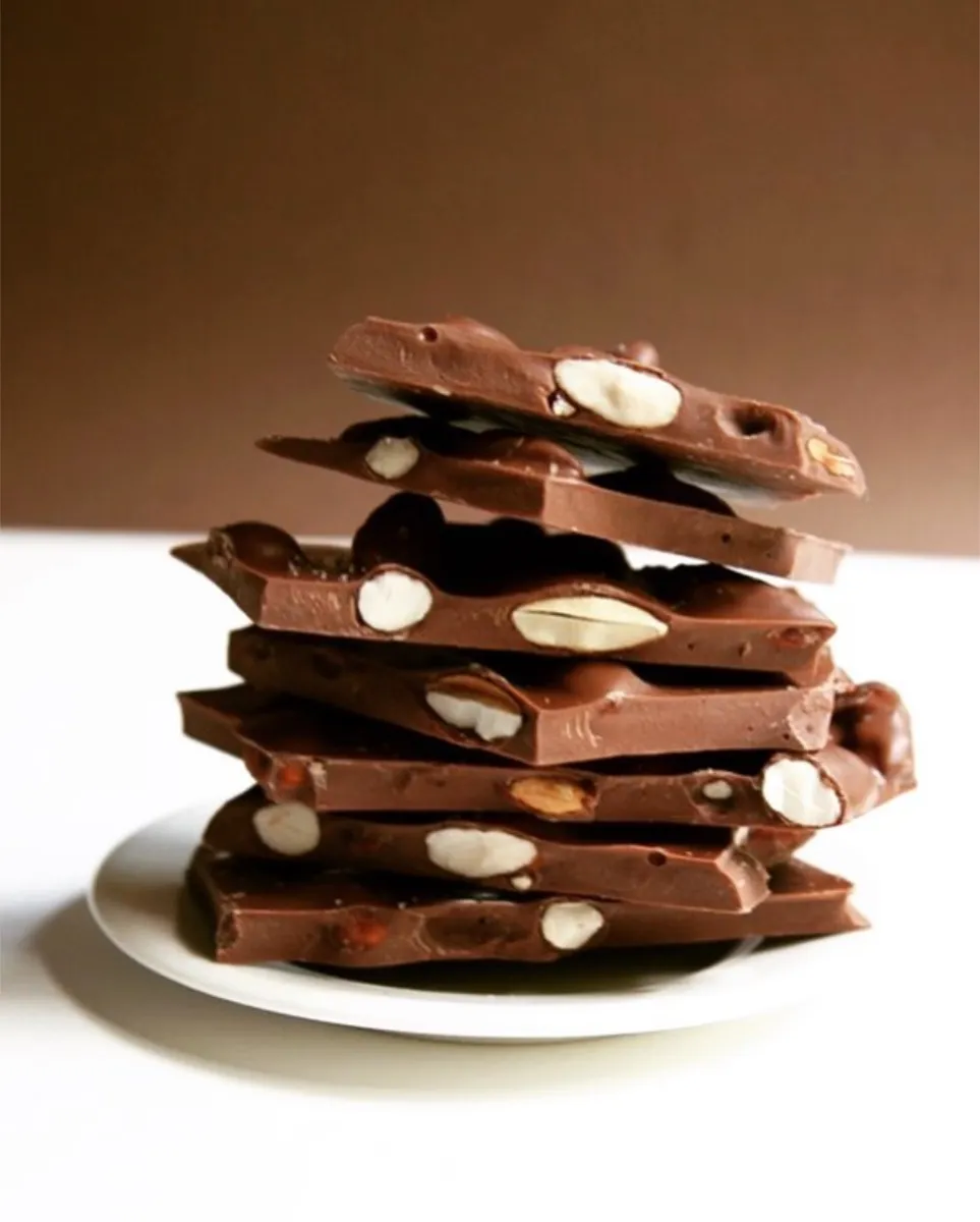 A stack of almond bark on a white plate