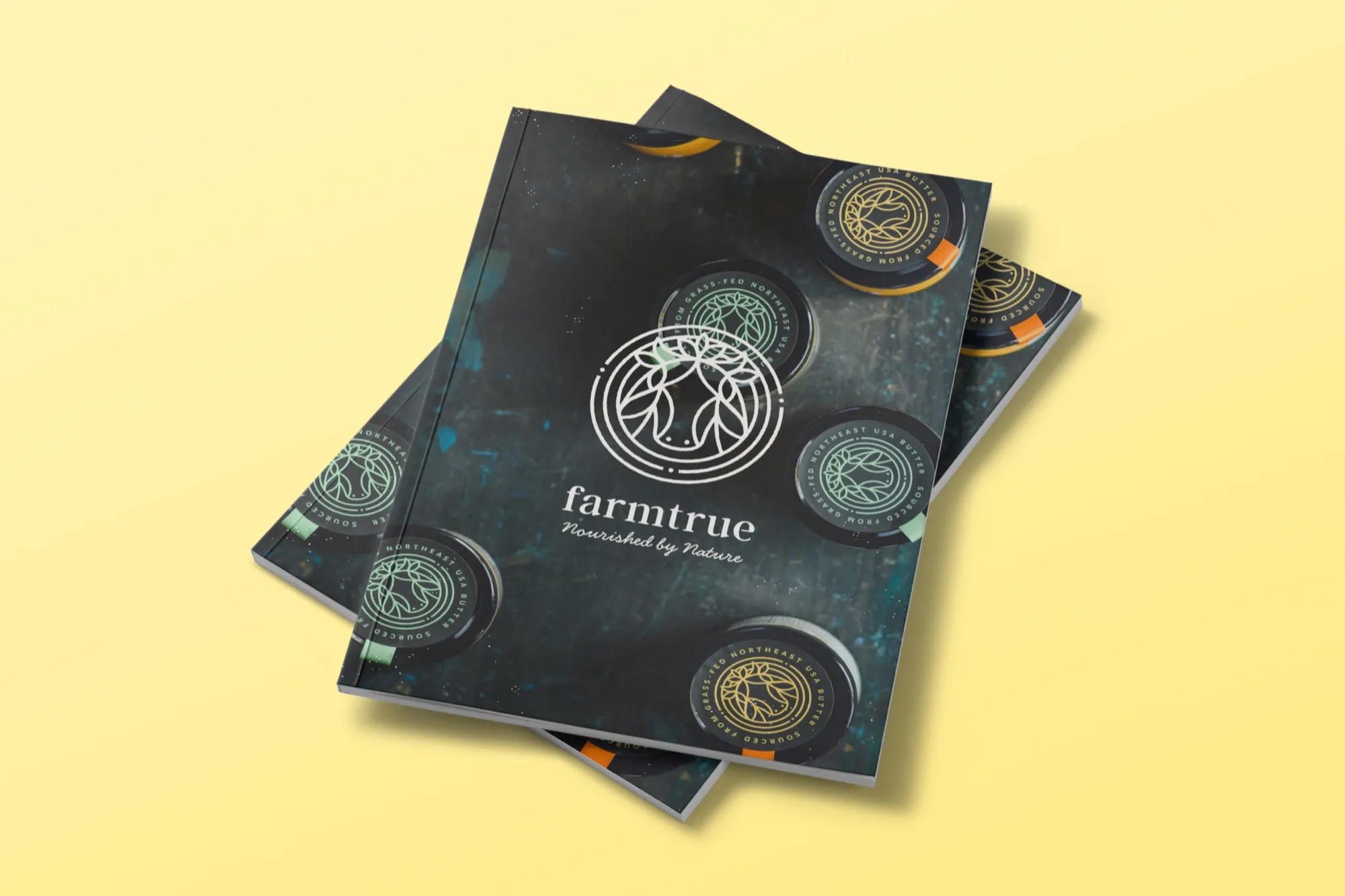 The FarmTrue brand book, its dark cover printed with the mark, on a yellow ground