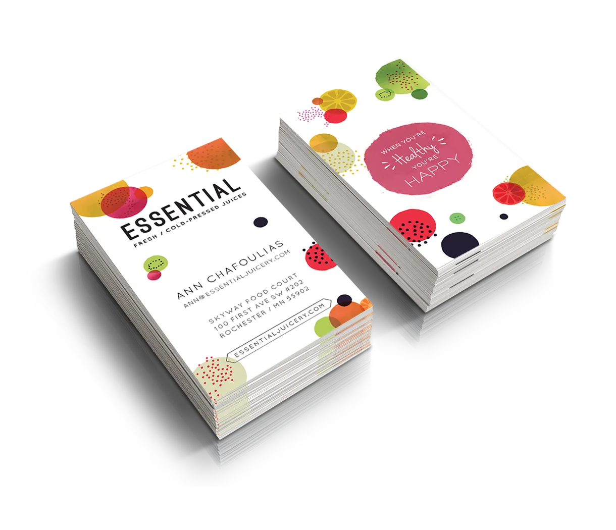 Essential Juicery business cards with ingredient illustrations