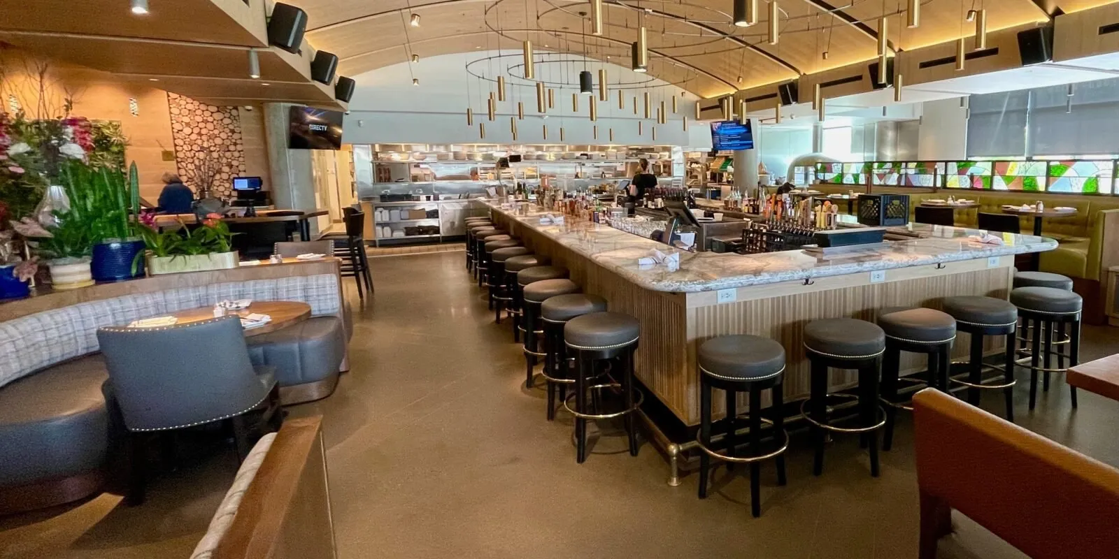 The Hazelwood bar, one of Nova’s polished-casual concepts, under a high arched ceiling