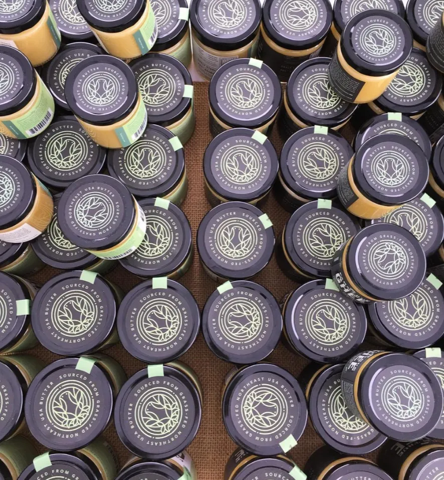 Dozens of jar lids from above, the mark printed on every one