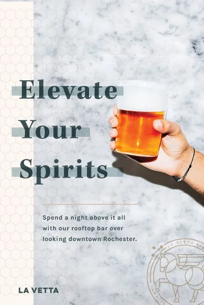 An “Elevate Your Spirits” poster: a hand raising a cocktail against marble, the La Vetta seal beneath