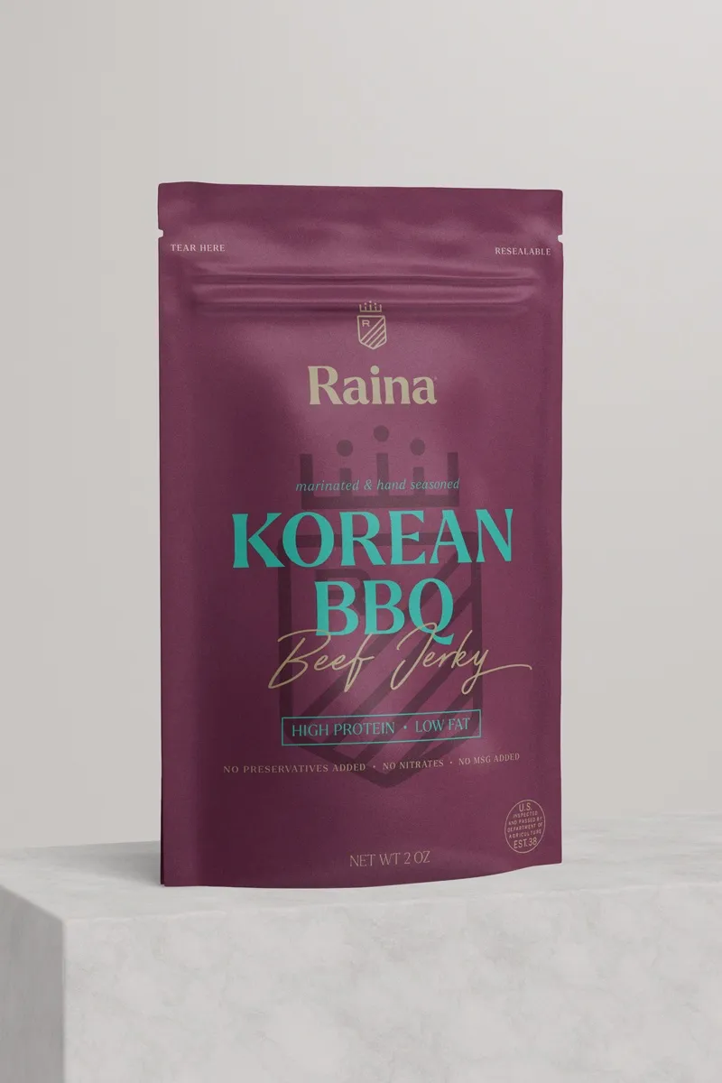 Korean BBQ beef jerky — the plum Raina pouch on a plinth