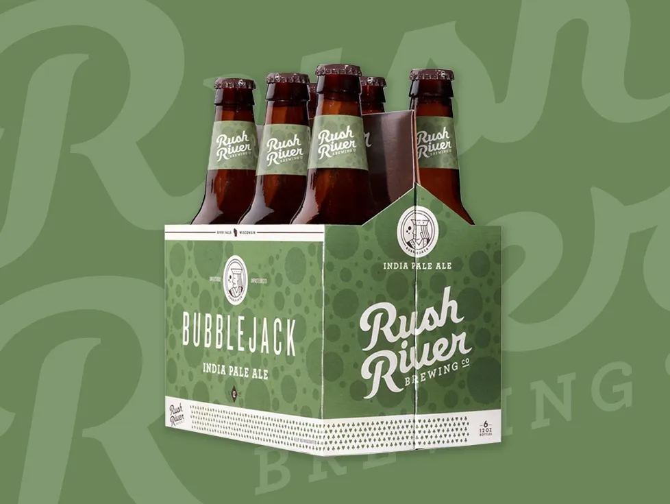 A Bubble Jack IPA six-pack, the Rush River script behind it