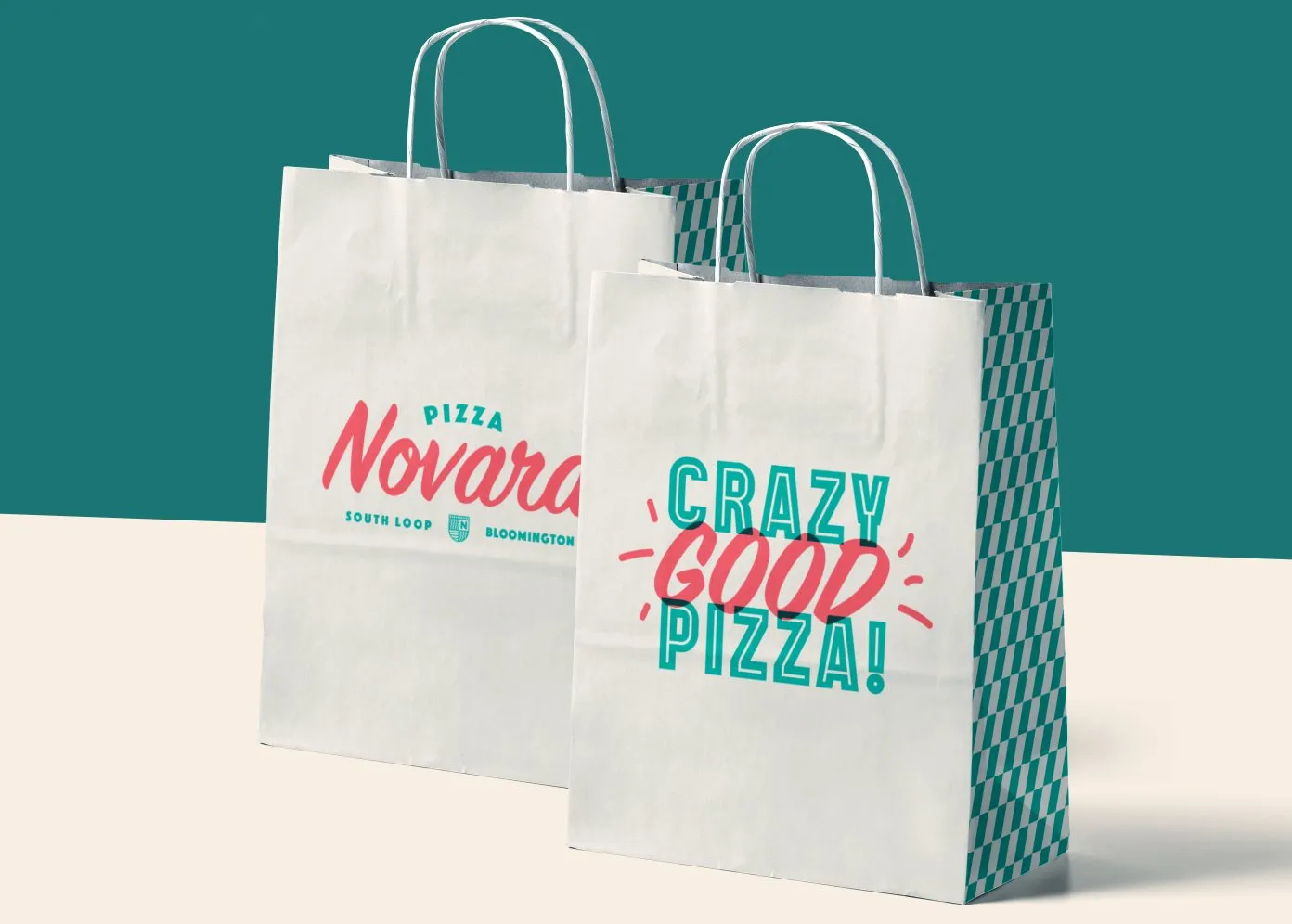 Two Pizza Novara to-go bags, one printed ‘Crazy Good Pizza!’